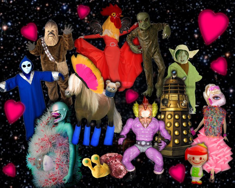 Digital collage of pop culture figures and toys against a black starry background with pink hearts. Figures include Chewbacca, a Dalek, and a rooster-headed figure. Bright, saturated colors.